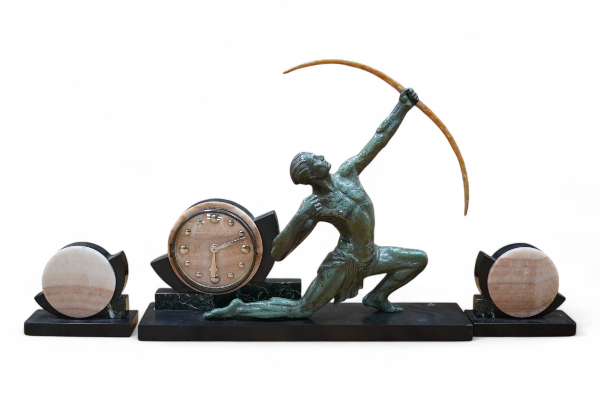 A French Art Deco spelter and marble ‘archer’ clock garniture, 60.5cm wide, 51.5cm high. Condition - fair to good